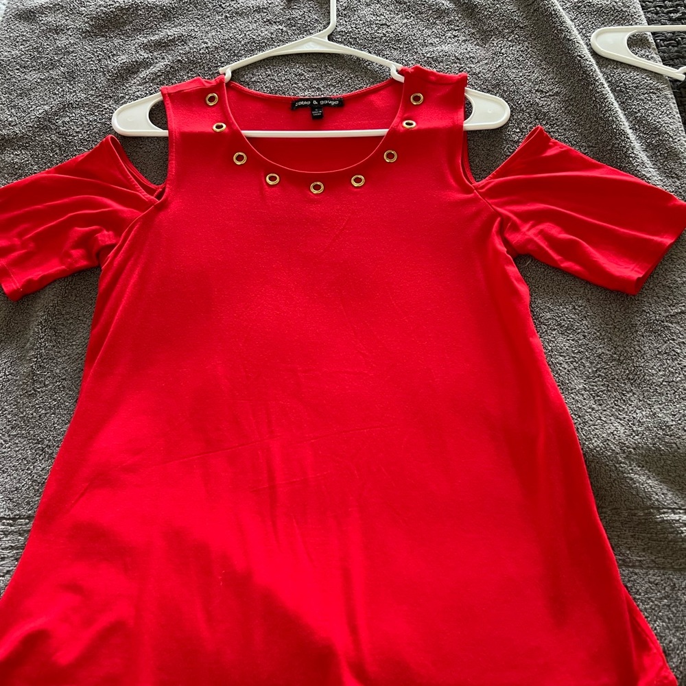 Beautiful red “cold shoulder” red top with gold accents.  Excellent condition